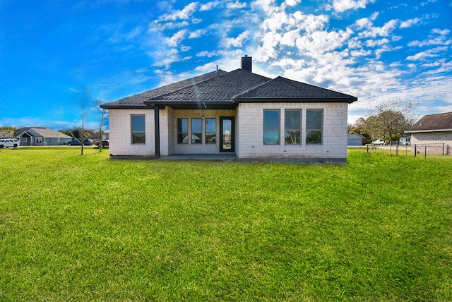 208 Silverleaf Rd, Sweeny, TX 77480 - back of property featuring brick siding, a chimney, and roof with shingles