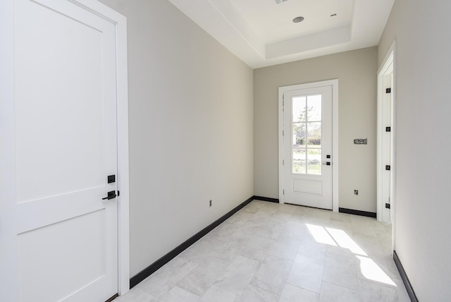 208 Silverleaf Rd, Sweeny, TX 77480 - doorway to outside featuring a raised ceiling and baseboards