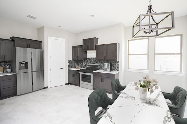 208 Silverleaf Rd, Sweeny, TX 77480 - kitchen with stainless steel refrigerator with ice dispenser, gas range, decorative backsplash, light countertops, and dark brown cabinetry