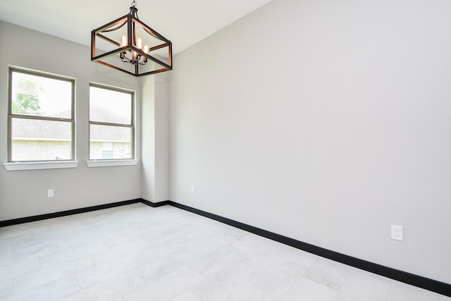 208 Silverleaf Rd, Sweeny, TX 77480 - spare room featuring a chandelier and baseboards