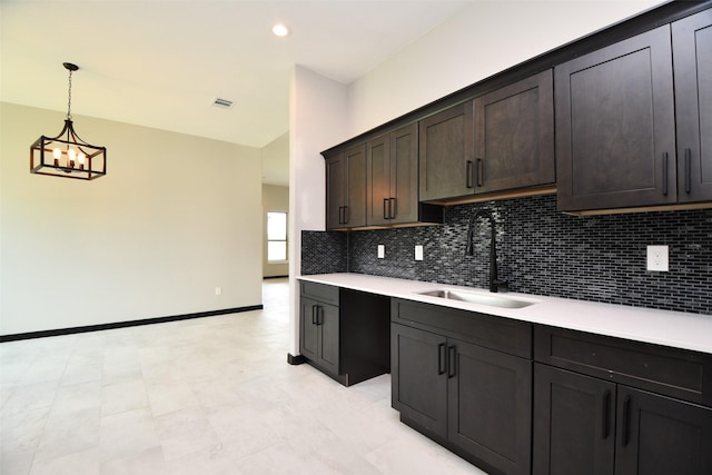 208 Silverleaf Rd, Sweeny, TX 77480 - kitchen with a sink, decorative backsplash, light countertops, pendant lighting, and recessed lighting