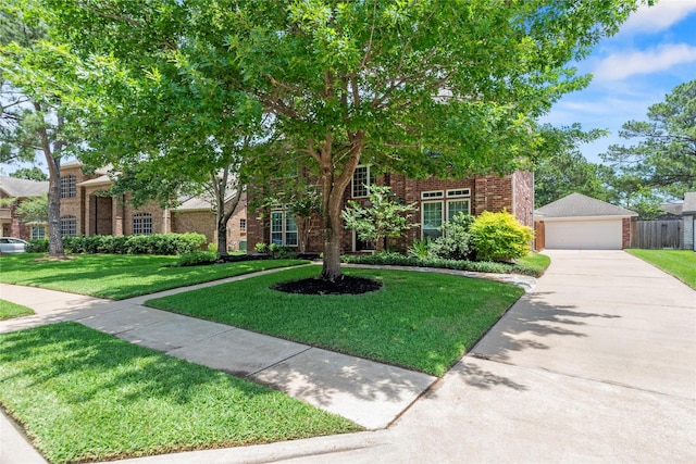7818 Palm Brook Ct, Houston, TX 77095 - view of front facade with brick siding, a front lawn, a garage, and an outdoor structure