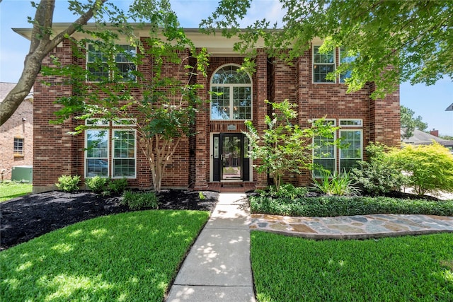 7818 Palm Brook Ct, Houston, TX 77095 - view of front of home featuring a front yard and brick siding