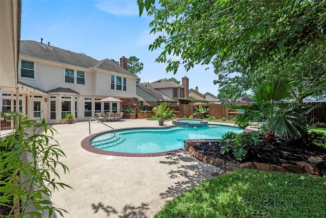 7818 Palm Brook Ct, Houston, TX 77095 - view of pool featuring a patio area, a fenced backyard, and a pool with connected hot tub