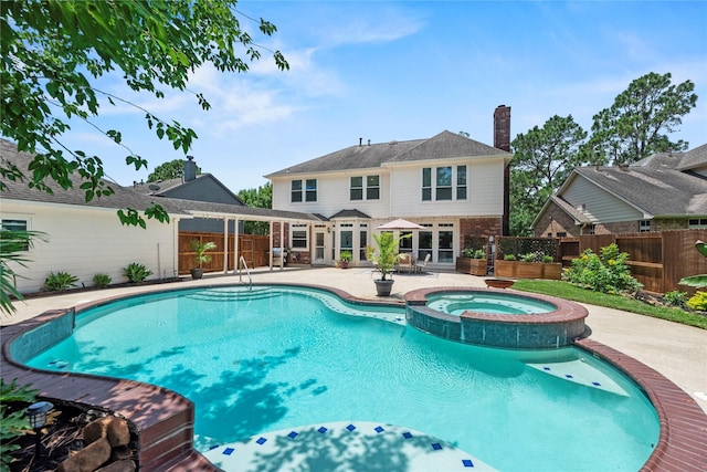 7818 Palm Brook Ct, Houston, TX 77095 - view of swimming pool with a patio area, a fenced backyard, and a pool with connected hot tub
