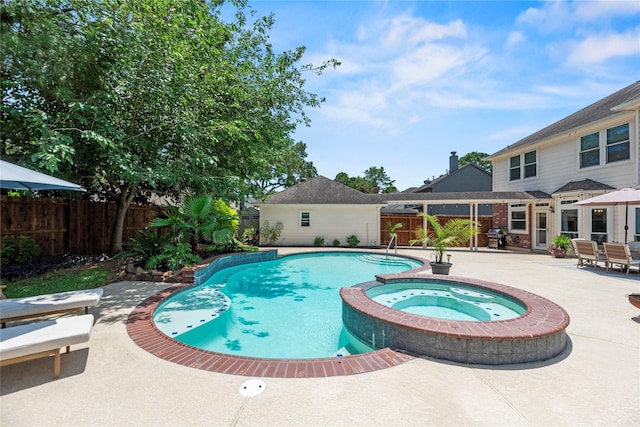7818 Palm Brook Ct, Houston, TX 77095 - view of swimming pool featuring a patio, a pool with connected hot tub, a fenced backyard, and a grill