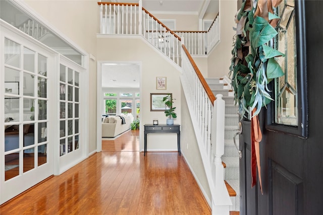 7818 Palm Brook Ct, Houston, TX 77095 - foyer entrance with stairs, wood finished floors, ornamental molding, baseboards, and a high ceiling