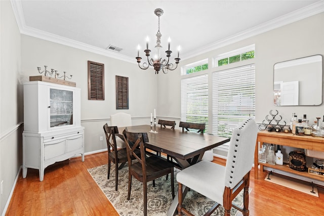 7818 Palm Brook Ct, Houston, TX 77095 - dining space featuring crown molding, a chandelier, light wood-style floors, and baseboards