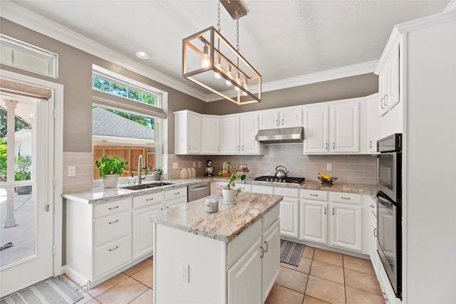 7818 Palm Brook Ct, Houston, TX 77095 - kitchen with a sink, under cabinet range hood, light tile patterned floors, appliances with stainless steel finishes, and crown molding