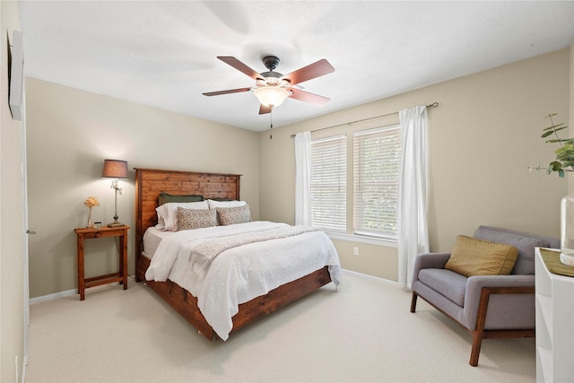 7818 Palm Brook Ct, Houston, TX 77095 - bedroom with light colored carpet, baseboards, and a ceiling fan