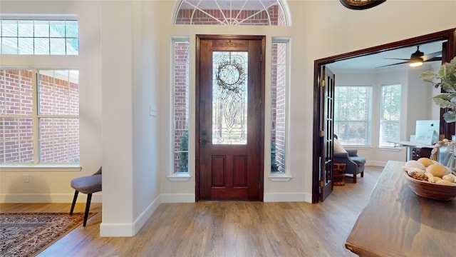 28511 E Benders Landing Blvd, Spring, TX 77386 - entryway with plenty of natural light, wood finished floors, baseboards, and a ceiling fan