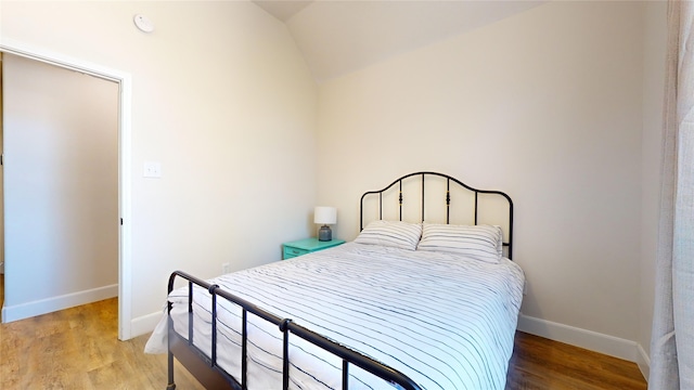 28511 E Benders Landing Blvd, Spring, TX 77386 - bedroom featuring lofted ceiling, baseboards, and light wood-style flooring