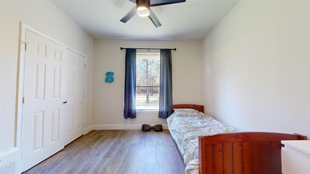 28511 E Benders Landing Blvd, Spring, TX 77386 - bedroom featuring light wood finished floors, baseboards, and a ceiling fan