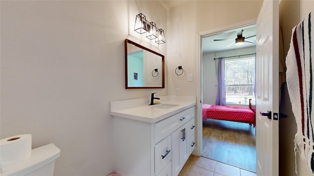 28511 E Benders Landing Blvd, Spring, TX 77386 - bathroom with vanity, toilet, tile patterned floors, a ceiling fan, and connected bathroom