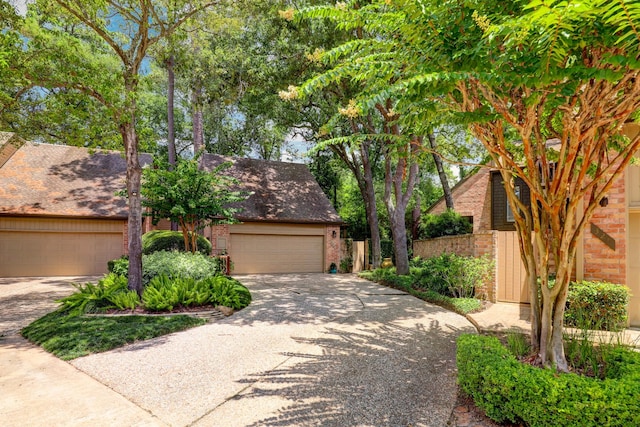 322 Sugarberry Cir, Houston, TX 77024 - view of front of property featuring brick siding, driveway, and an attached garage
