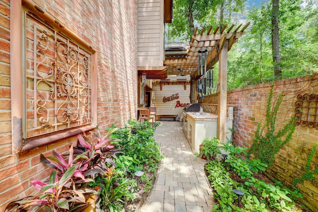 322 Sugarberry Cir, Houston, TX 77024 - view of exterior entry featuring brick siding