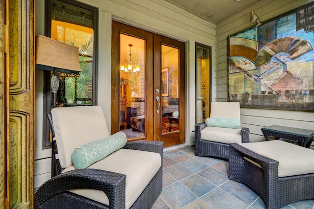 322 Sugarberry Cir, Houston, TX 77024 - sunroom featuring a chandelier and french doors