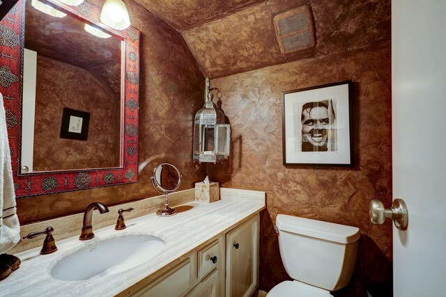 322 Sugarberry Cir, Houston, TX 77024 - half bath featuring lofted ceiling, vanity, and toilet