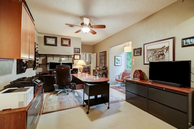 322 Sugarberry Cir, Houston, TX 77024 - home office featuring ceiling fan, a textured ceiling, and light wood finished floors