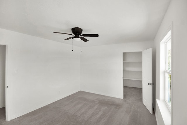 1101 2nd Ave N, Texas City, TX 77590 - carpeted spare room featuring healthy amount of natural light, ceiling fan, and baseboards