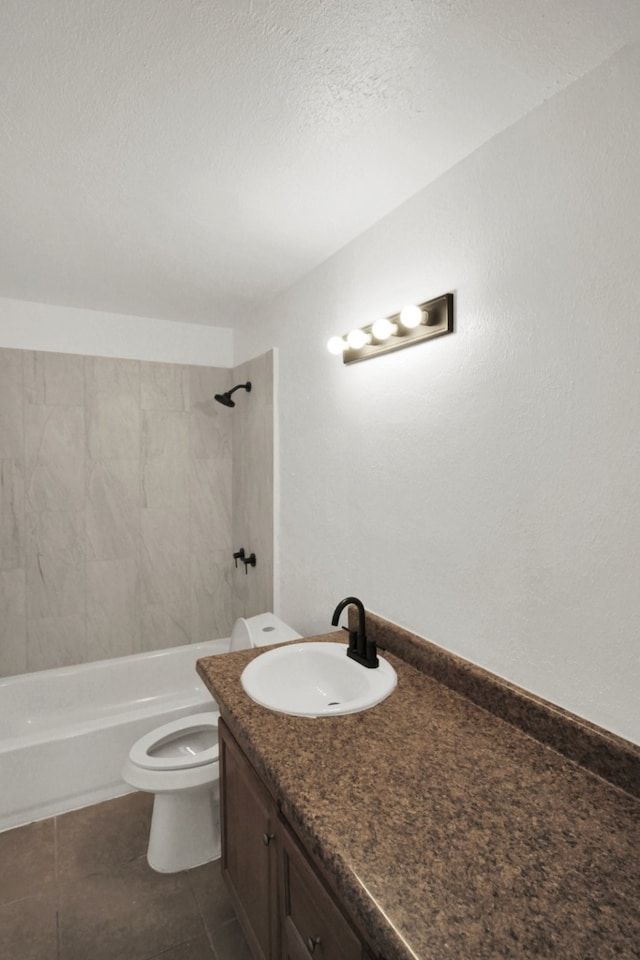 1101 2nd Ave N, Texas City, TX 77590 - bathroom featuring toilet, vanity, tub / shower combination, a textured ceiling, and tile patterned floors