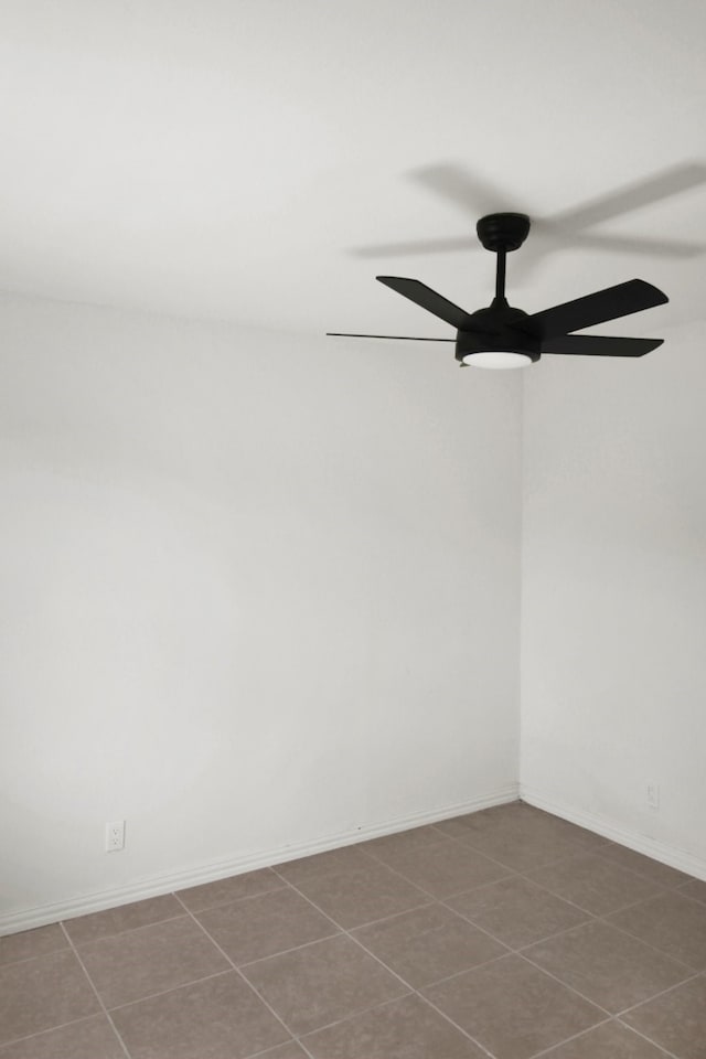 1101 2nd Ave N, Texas City, TX 77590 - tiled empty room featuring ceiling fan and baseboards