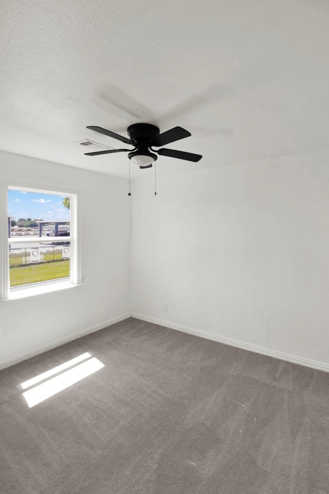 1101 2nd Ave N, Texas City, TX 77590 - carpeted empty room with a ceiling fan and baseboards