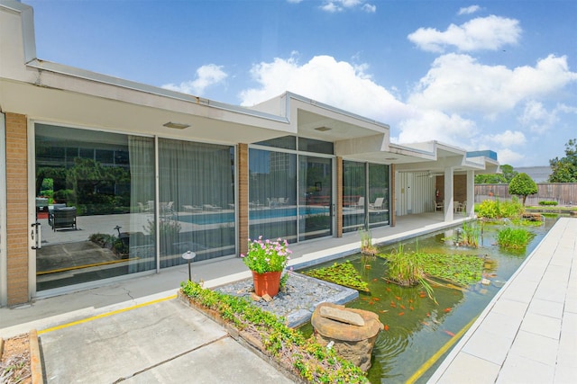 5050 Woodway Dr Unit 3M, Houston, TX 77056 - back of property with a patio