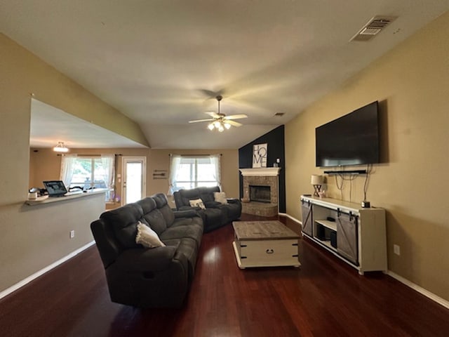 440 Maggie Cir, Flint, TX 75762 - living area featuring a glass covered fireplace, dark wood-type flooring, baseboards, ceiling fan, and vaulted ceiling