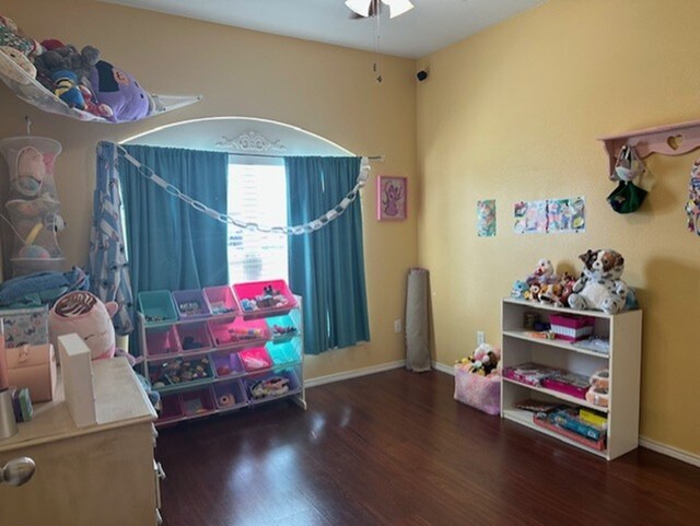 440 Maggie Cir, Flint, TX 75762 - playroom with wood finished floors, a ceiling fan, and baseboards