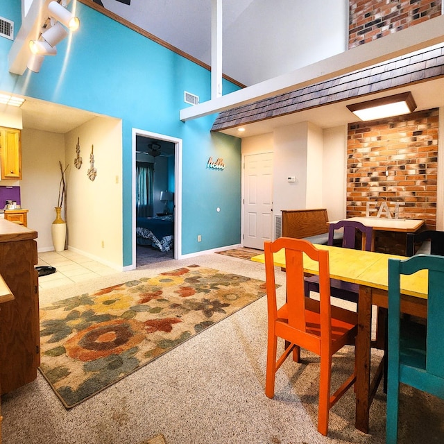 278 Shelter Cove Dr, Livingston, TX 77351 - dining space with a high ceiling, carpet flooring, and baseboards