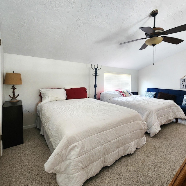 278 Shelter Cove Dr, Livingston, TX 77351 - carpeted bedroom featuring a ceiling fan, a textured ceiling, and baseboards
