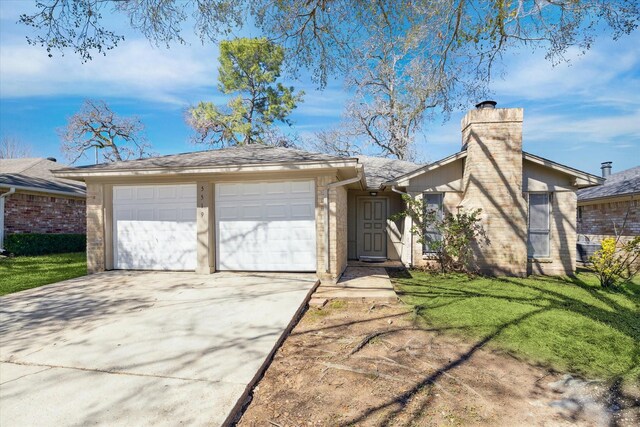 5519 Fallengate Dr, Spring, TX 77373 - view of front of property featuring driveway, a garage, a chimney, and a front lawn