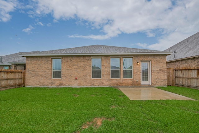 9715 Deborah Colony Ln, Humble, TX 77396 - rear view of property featuring a patio area, brick siding, and a shingled roof