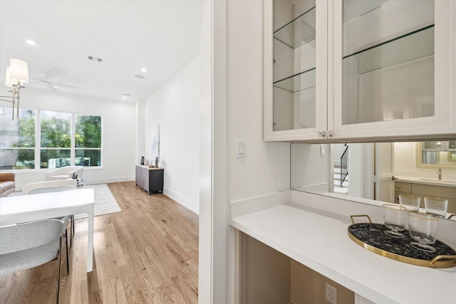 506 Parker St, Houston, TX 77007 - bar with light wood-style floors, a ceiling fan, recessed lighting, baseboards, and a sink