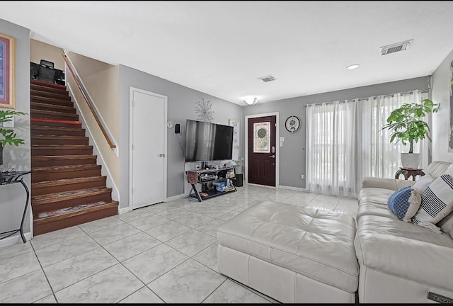 15133 Elstree Dr, Channelview, TX 77530 - living area featuring stairs, baseboards, and light tile patterned floors
