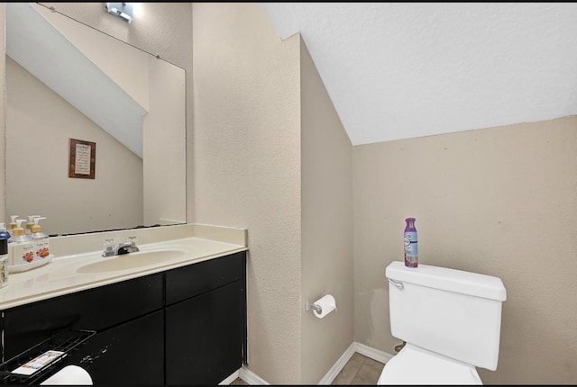 15133 Elstree Dr, Channelview, TX 77530 - bathroom featuring vaulted ceiling, toilet, vanity, and baseboards