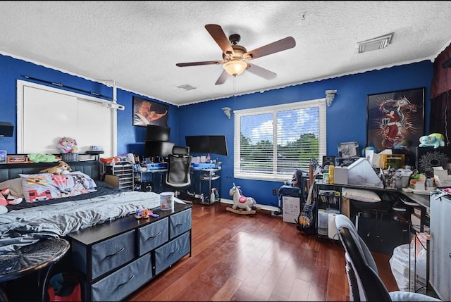 15133 Elstree Dr, Channelview, TX 77530 - bedroom featuring an office area, a textured ceiling, wood-type flooring, baseboards, and ceiling fan