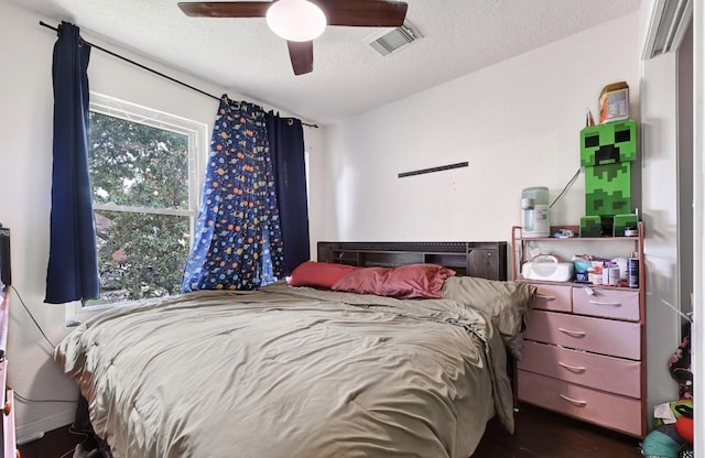 15133 Elstree Dr, Channelview, TX 77530 - bedroom with a textured ceiling and ceiling fan