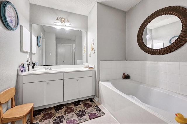 15133 Elstree Dr, Channelview, TX 77530 - full bath with a bath, vanity, and a textured ceiling
