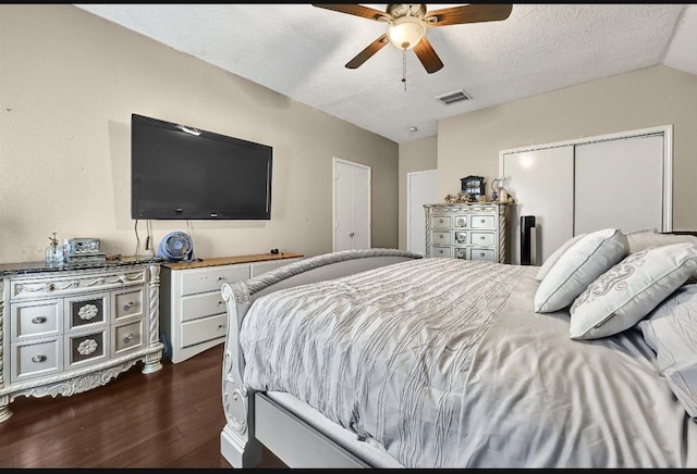 15133 Elstree Dr, Channelview, TX 77530 - bedroom featuring dark wood-type flooring, a textured ceiling, and ceiling fan