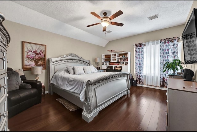 15133 Elstree Dr, Channelview, TX 77530 - bedroom featuring wood finished floors, a textured ceiling, a ceiling fan, and lofted ceiling
