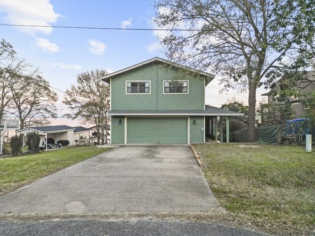 283 Sam Loop, Houston Loop, Point Blank, TX 77364 - view of front of property with asphalt driveway, an attached garage, and a front lawn