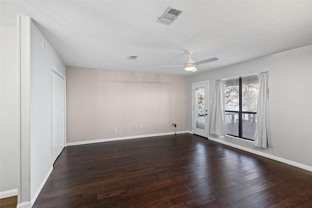 283 Sam Loop, Houston Loop, Point Blank, TX 77364 - empty room with ceiling fan, dark wood-style flooring, a textured ceiling, and baseboards