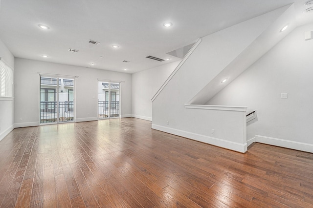 1266 N Post Oak Rd Unit B, Houston, TX 77055 - unfurnished living room featuring hardwood / wood-style flooring and recessed lighting