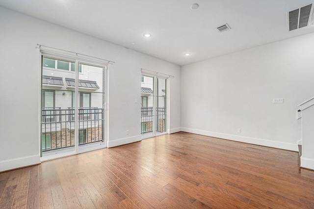 1266 N Post Oak Rd Unit B, Houston, TX 77055 - unfurnished room with hardwood / wood-style flooring and recessed lighting