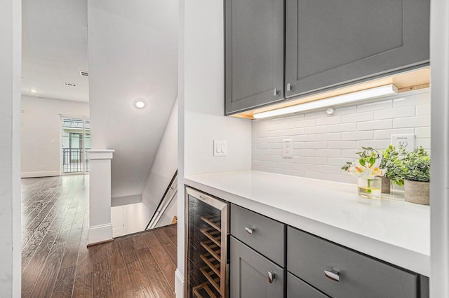 1266 N Post Oak Rd Unit B, Houston, TX 77055 - bar featuring wine cooler, dark wood finished floors, backsplash, and recessed lighting