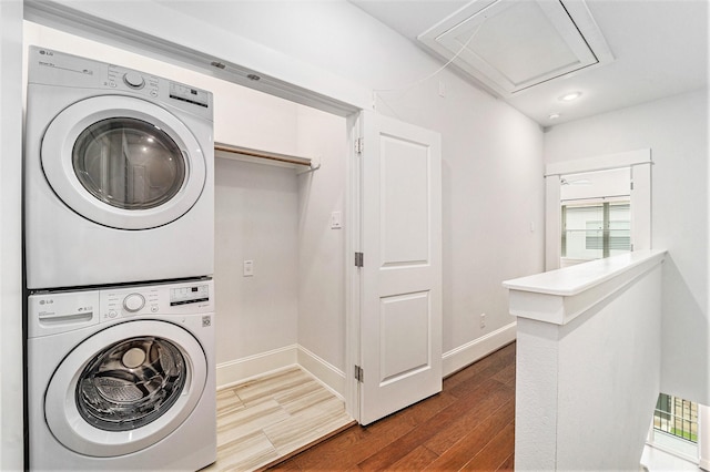 1266 N Post Oak Rd Unit B, Houston, TX 77055 - laundry area with stacked washer and clothes dryer, attic access, dark wood-type flooring, and recessed lighting