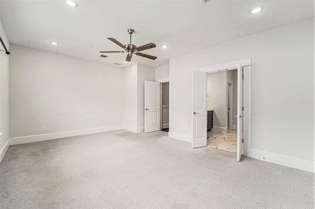 1266 N Post Oak Rd Unit B, Houston, TX 77055 - unfurnished bedroom with light carpet, recessed lighting, ensuite bathroom, and a ceiling fan
