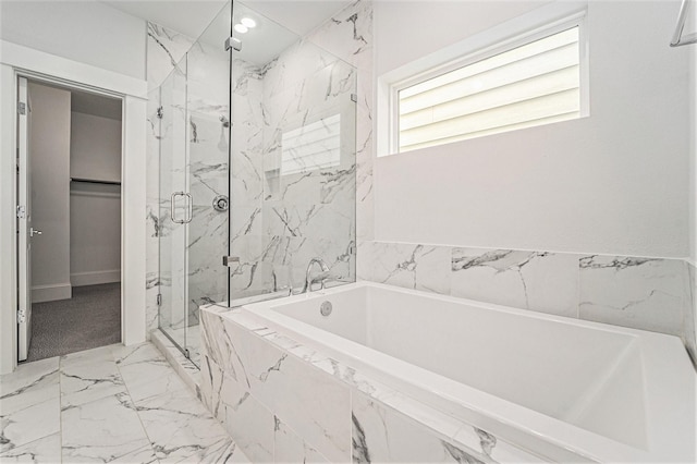1266 N Post Oak Rd Unit B, Houston, TX 77055 - bathroom with marble look tile flooring, a marble finish shower, and a bath